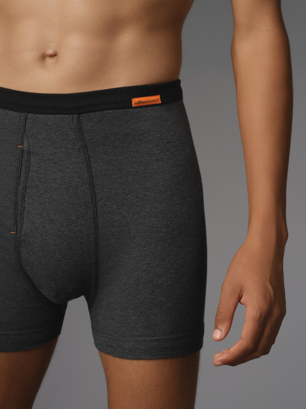 Short underwear with fly by Comazo Protect in blue melange color. Close-up front view: Man wearing Short underwear with fly by Comazo Protect in blue melange color.