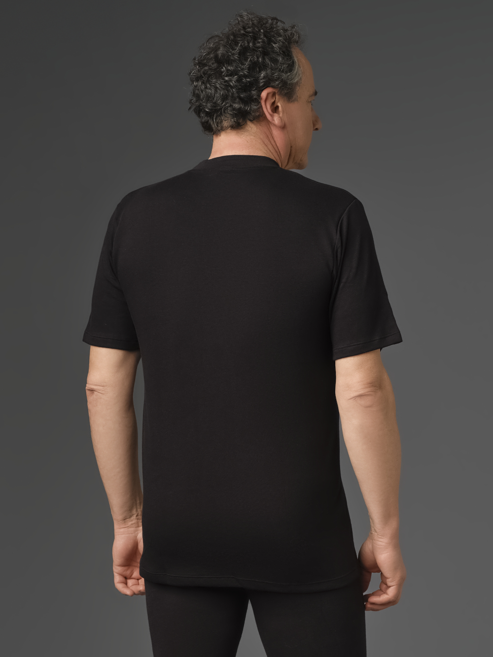 Short Sleeve Shirt made of Two-Layer Material by Comazo Protect in Black Back View: Man wearing Short Sleeve Shirt made of Two-Layer Material by Comazo Protect in Black