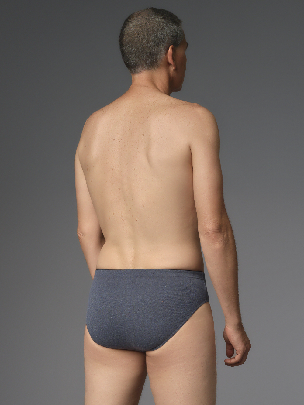 Briefs by Comazo Protect in blue melange color. Back view: Man wearing Briefs by Comazo Protect in blue melange color.