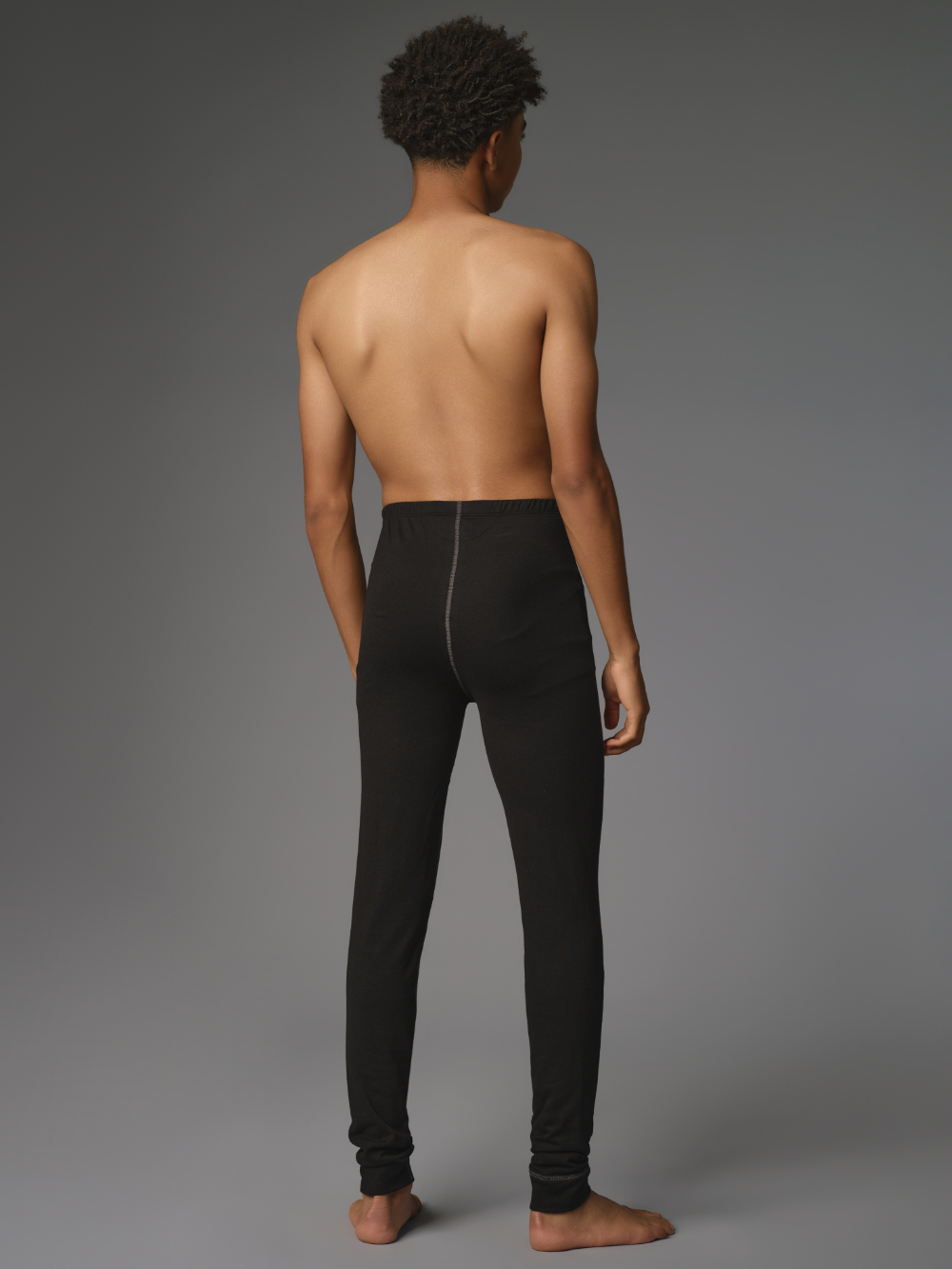 Comazo Protect men's functional pants "warm & clima" in black Back view: Man wearing Comazo Protect men's functional pants "warm & clima" in black