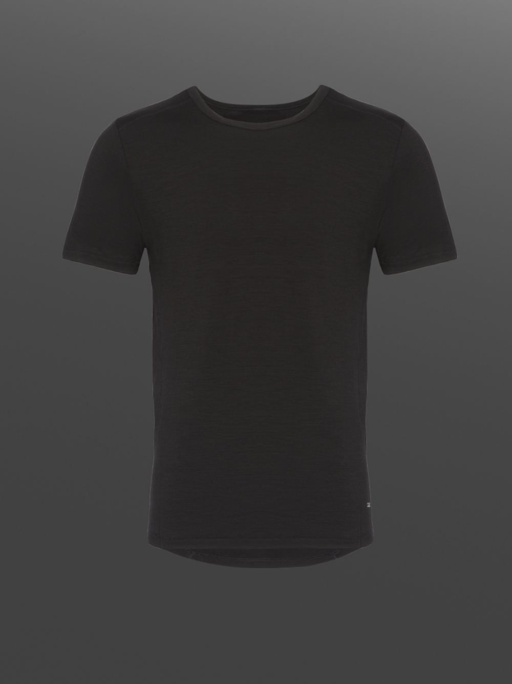 Comazo men's short-sleeve shirt made of merino wool, color black. Product image front view: Short-sleeve shirt made of merino wool by Comazo in black color with extended back panel and crew neck.