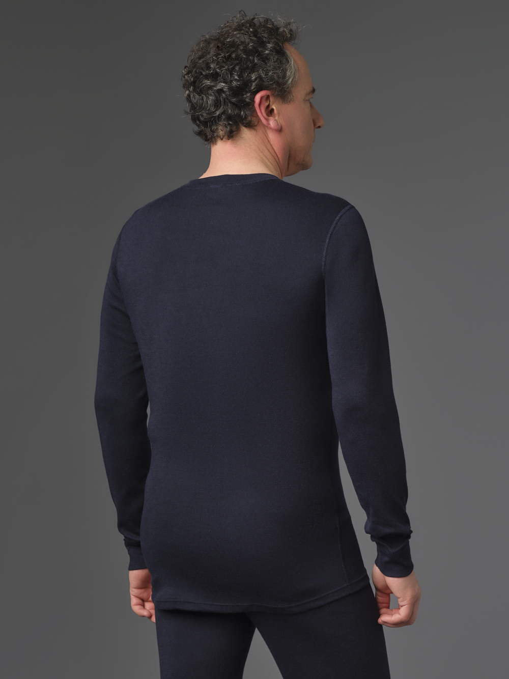 Flame-retardant long-sleeve shirt by Comazo Protect in navy color. Rear view: Man wearing flame-retardant long-sleeve shirt by Comazo Protect in navy color.