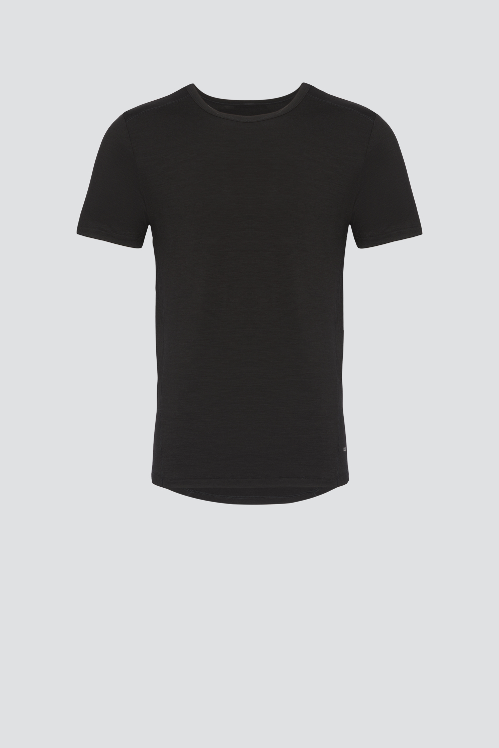 Comazo men's short-sleeve shirt made of merino wool, color black. Product image front view: Short-sleeve shirt made of merino wool by Comazo in black color with extended back panel and crew neck.