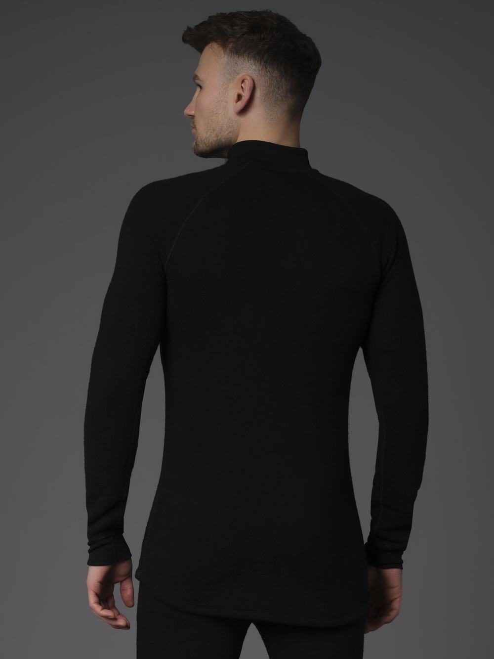 High-Quality Merino Wool Shirt with Zip Collar (Mulesing Free) by Comazo Protect in Black Back View: Man wearing High-Quality Merino Wool Shirt with Zip Collar (Mulesing Free) by Comazo Protect in Black