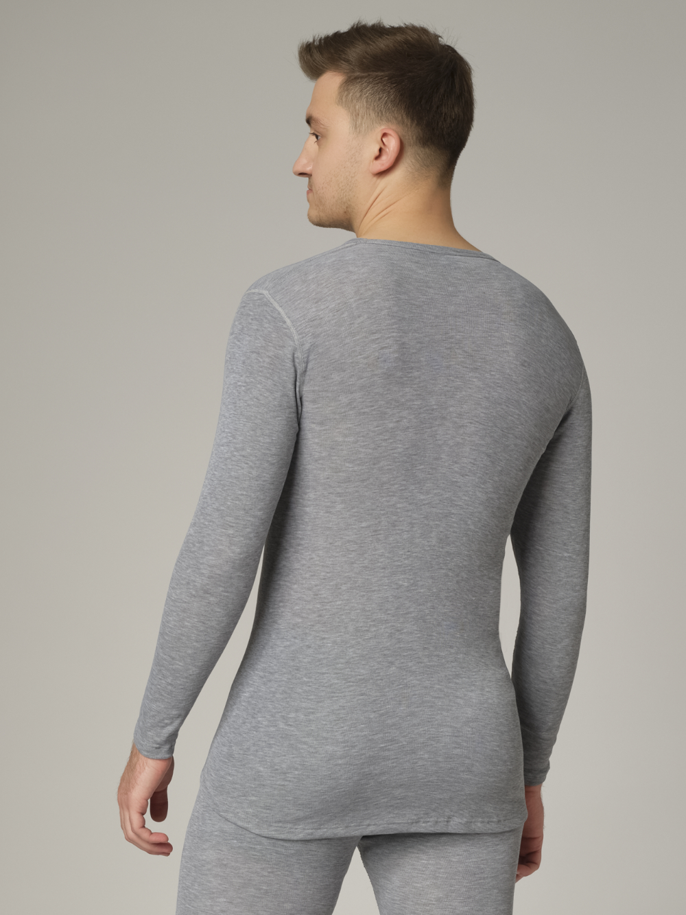 Comazo Unisex Functional Shirt "warm extra" Long Sleeve in Grey Mélange Back View: Man wearing Unisex Functional Shirt "warm extra" Long Sleeve by Comazo in Grey Mélange