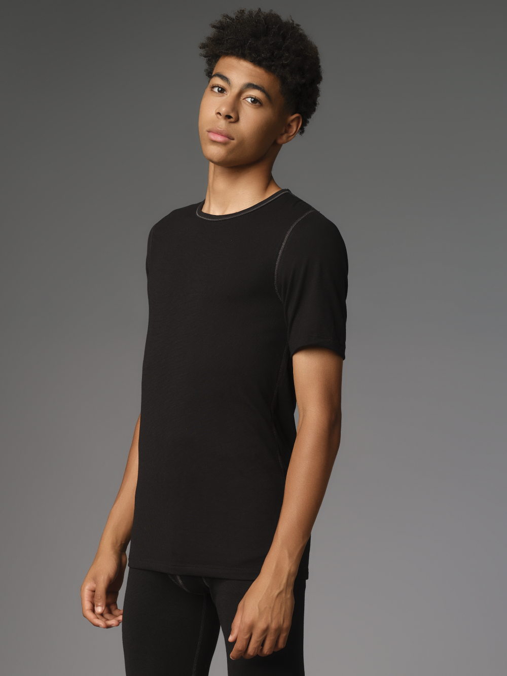 Comazo Protect men's short-sleeved functional shirt "warm & clima" in black Front view: Man wearing Comazo Protect men's short-sleeved functional shirt "warm & clima" in black.