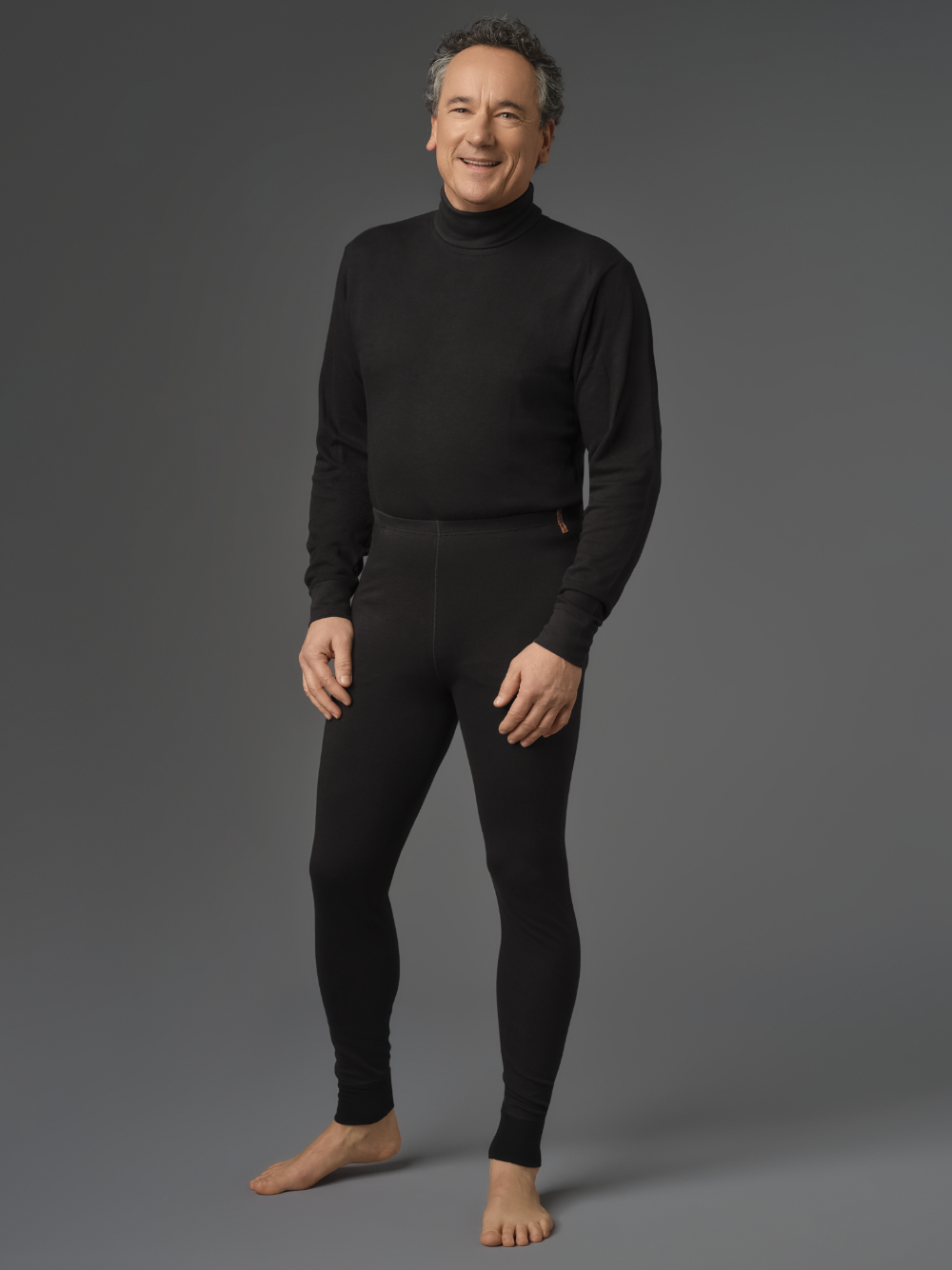Functional pants made from two-layer material by Comazo Protect in black color. Front view: Man wearing functional pants made from two-layer material by Comazo Protect in black color.