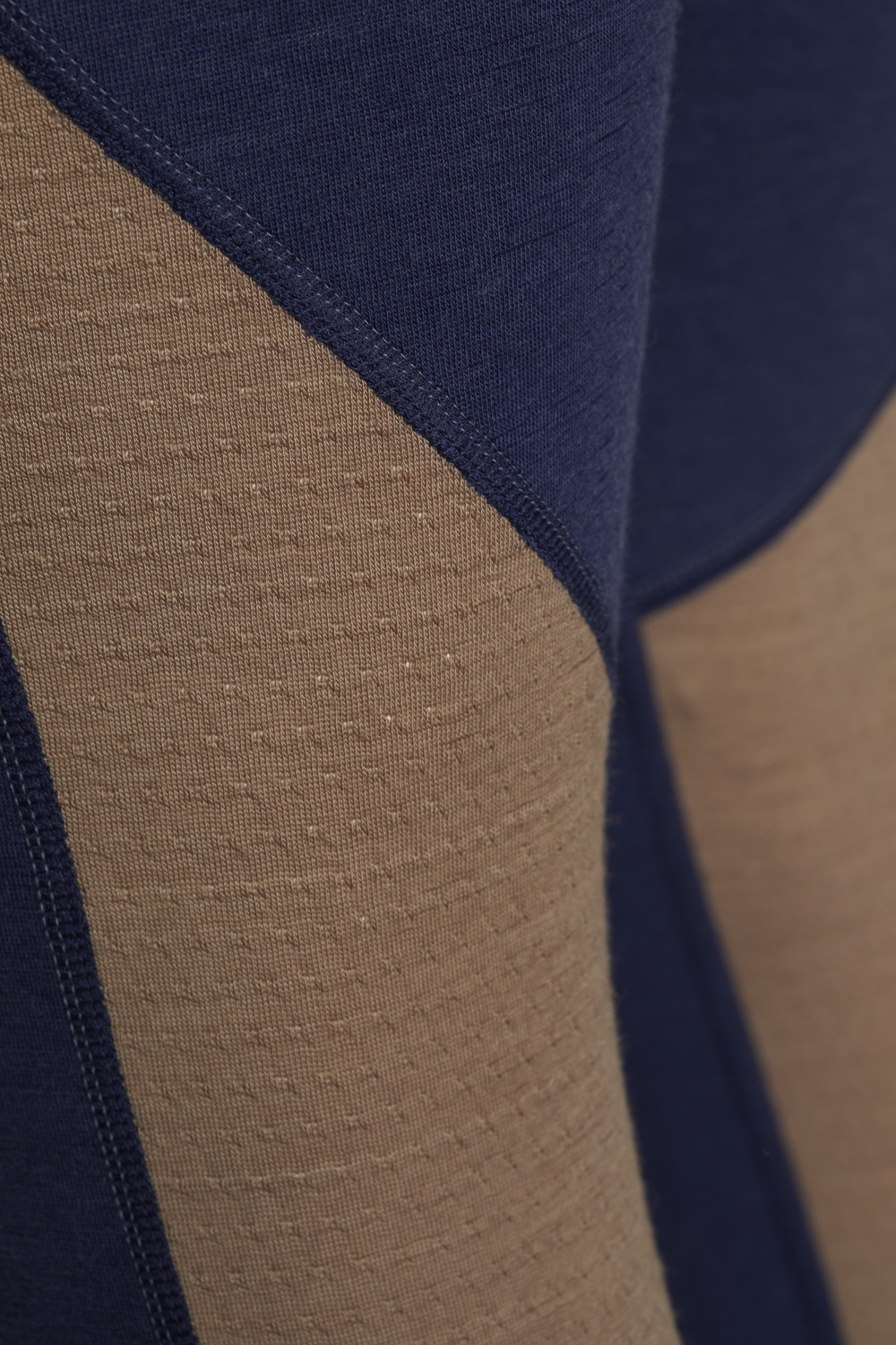 Comazo men's long underpants made of merino wool, color dark blue/coffee. Detail image: Long underpants made of 100% mulesing-free merino wool by Comazo in dark blue/coffee color with Comazo logo waistband.