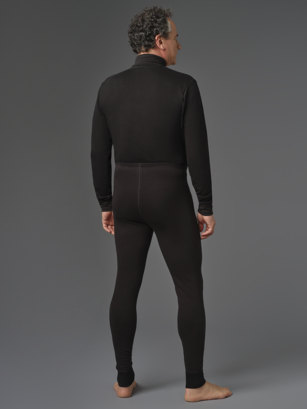 Functional pants made from two-layer material by Comazo Protect in black color. Rear view: Man wearing functional pants made from two-layer material by Comazo Protect in black color.