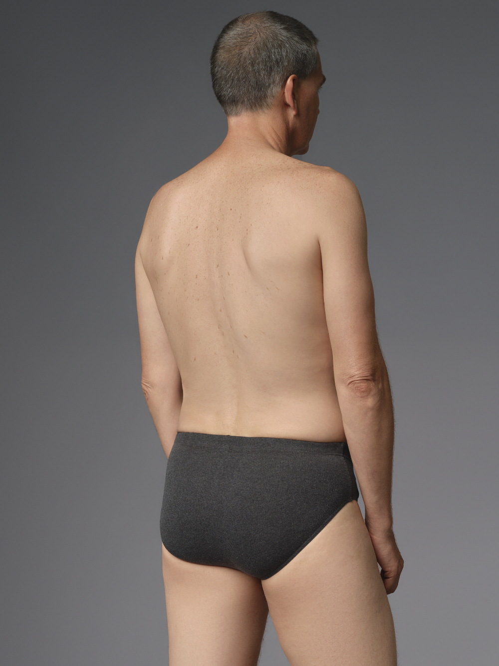 Briefs by Comazo Protect in dark gray melange color. Back view: Man wearing Briefs by Comazo Protect in dark gray melange color.