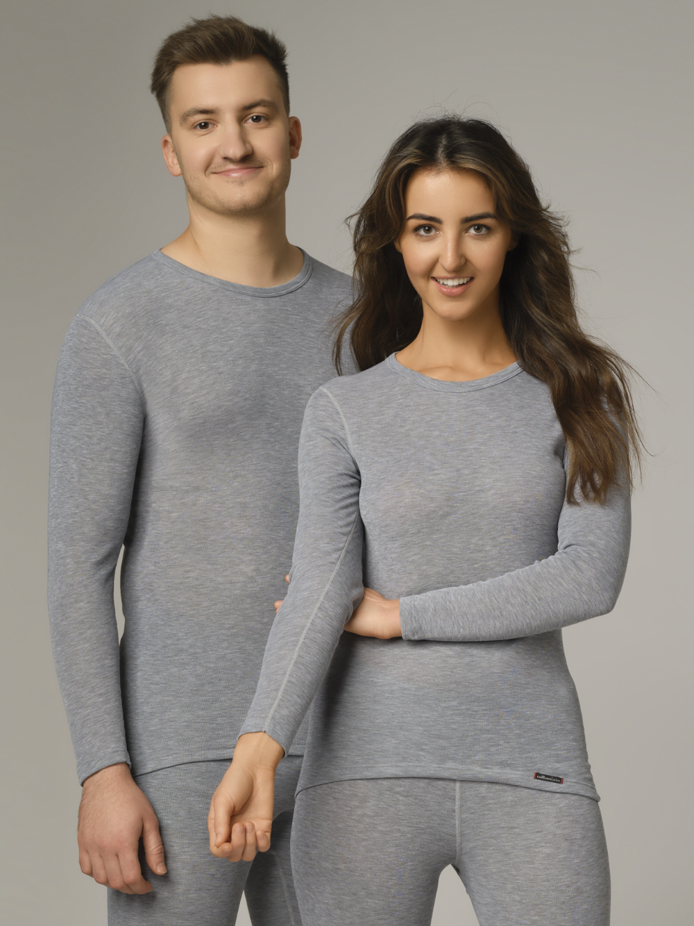 Comazo Unisex Functional Shirt "warm extra" Long Sleeve in Grey Mélange Front View: A man and a woman wearing Unisex Functional Shirt "warm extra" Long Sleeve by Comazo in Grey Mélange