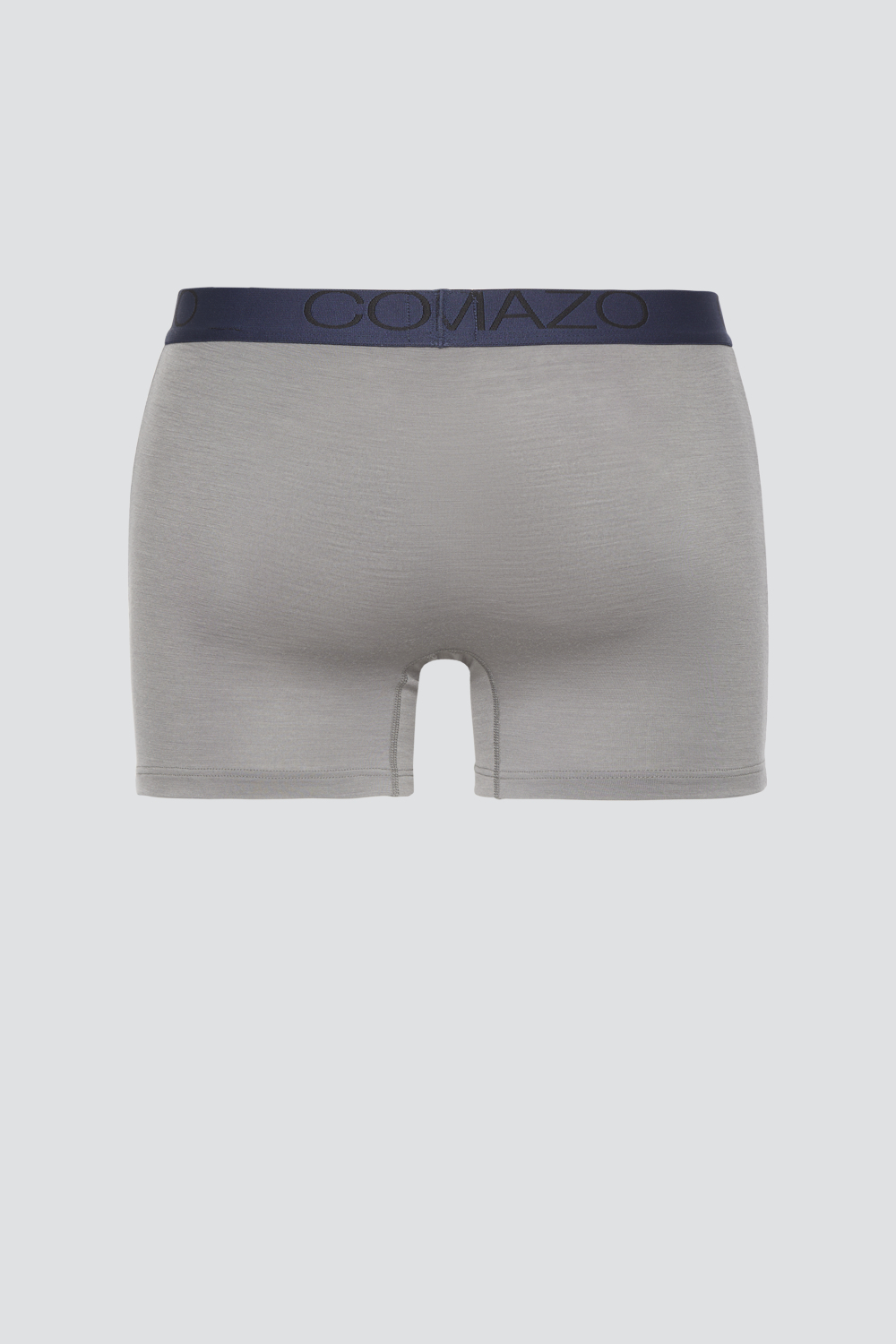 Comazo men's trunks made of merino wool in the color Steelgrey/Mustard. Product image back view of the merino wool trunks from Comazo in the color Steelgrey/Mustard with lettering on the waistband.