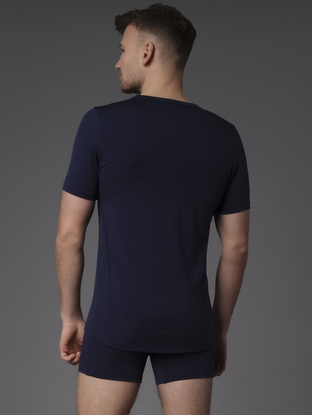 Comazo protect Durable Merino Wool Short Sleeve Shirt in Navy Back View: Man wearing Durable Merino Wool Short Sleeve Shirt by Comazo Protect in Navy
