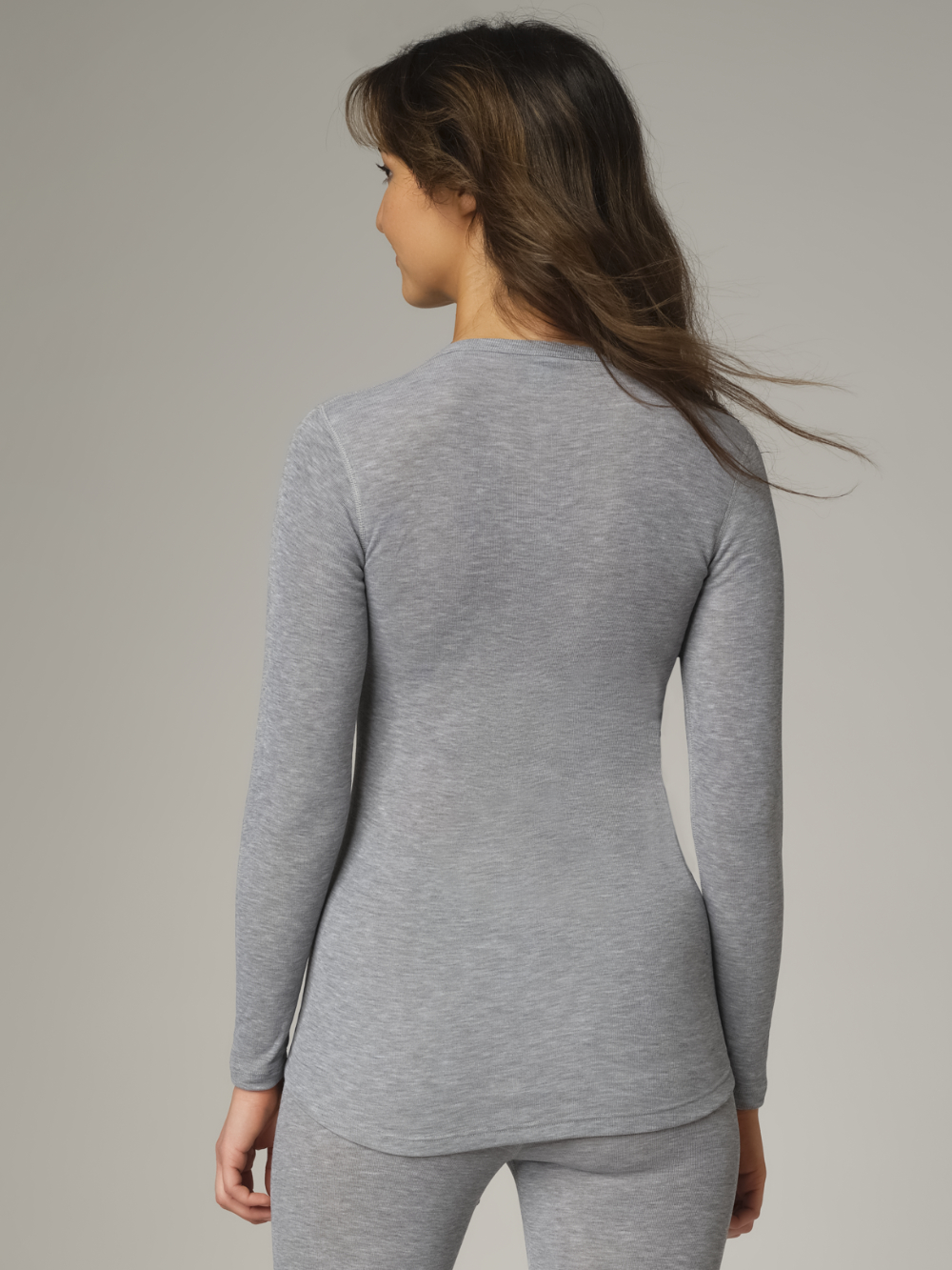 Comazo Unisex Functional Shirt "warm extra" Long Sleeve in Grey Mélange Back View: Woman wearing Unisex Functional Shirt "warm extra" Long Sleeve by Comazo in Grey Mélange