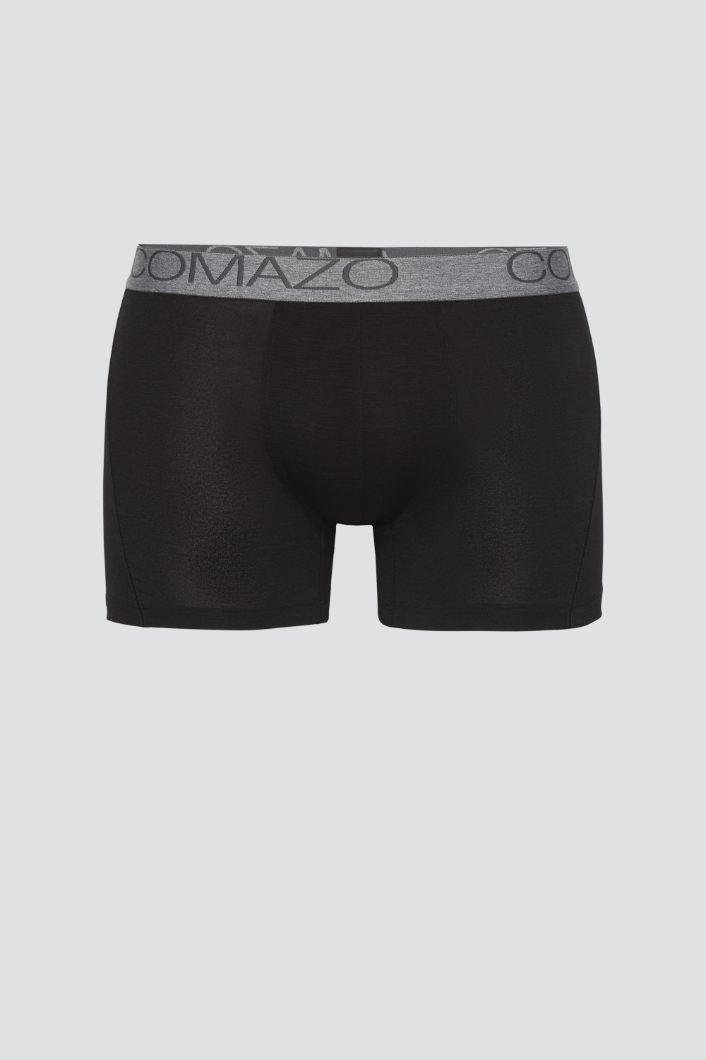 Comazo men's trunks made of merino wool in the color black. Product image front view of the merino wool trunks from Comazo in the color black with lettering on the waistband.