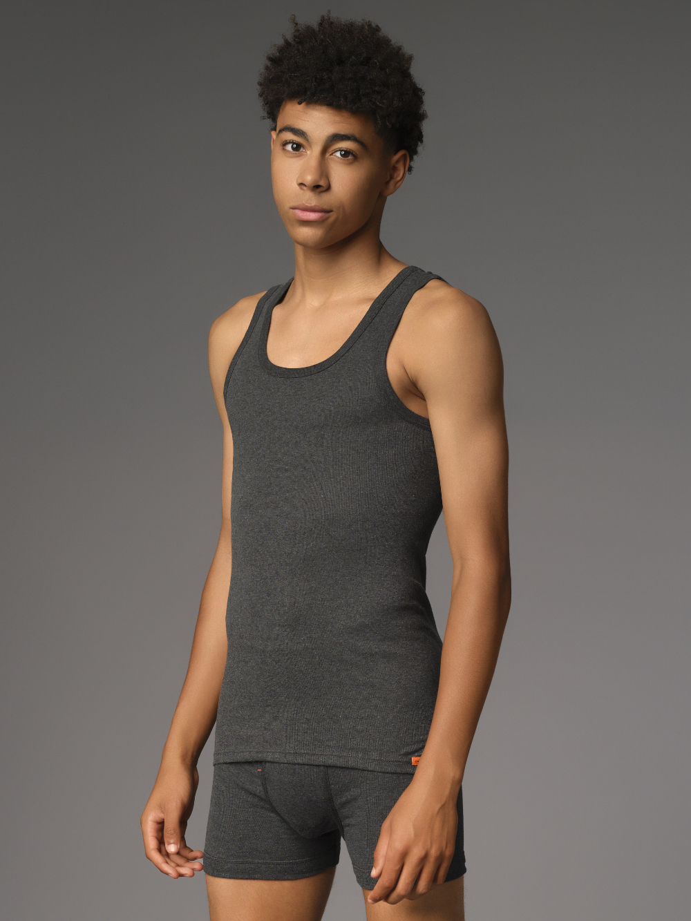 Undershirt by Comazo Protect in dark gray melange color. Front view: Man wearing Undershirt by Comazo Protect in dark gray melange color.