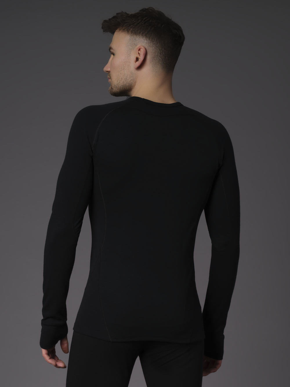 Functional shirt with mulesing-free merino wool by Comazo Protect, color black Back view: Man wearing Functional shirt with mulesing-free merino wool by Comazo Protect, color black