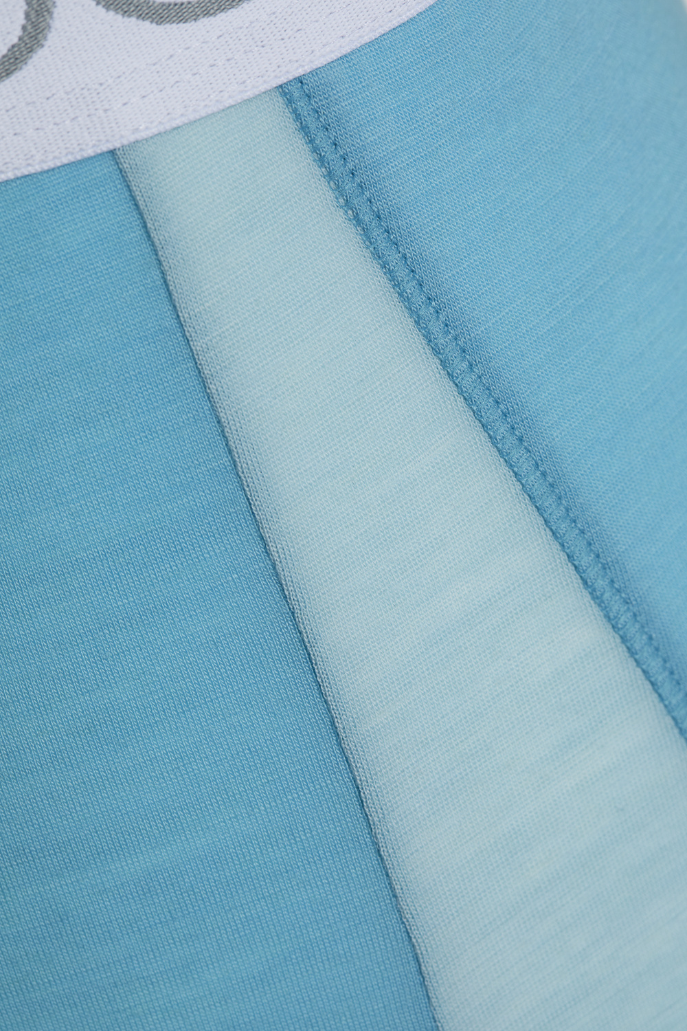 Comazo men's trunks made of merino wool in the color Seablue/Ice. Detail image front view of the merino wool trunks from Comazo in the color Seablue/Ice with lettering on the waistband.