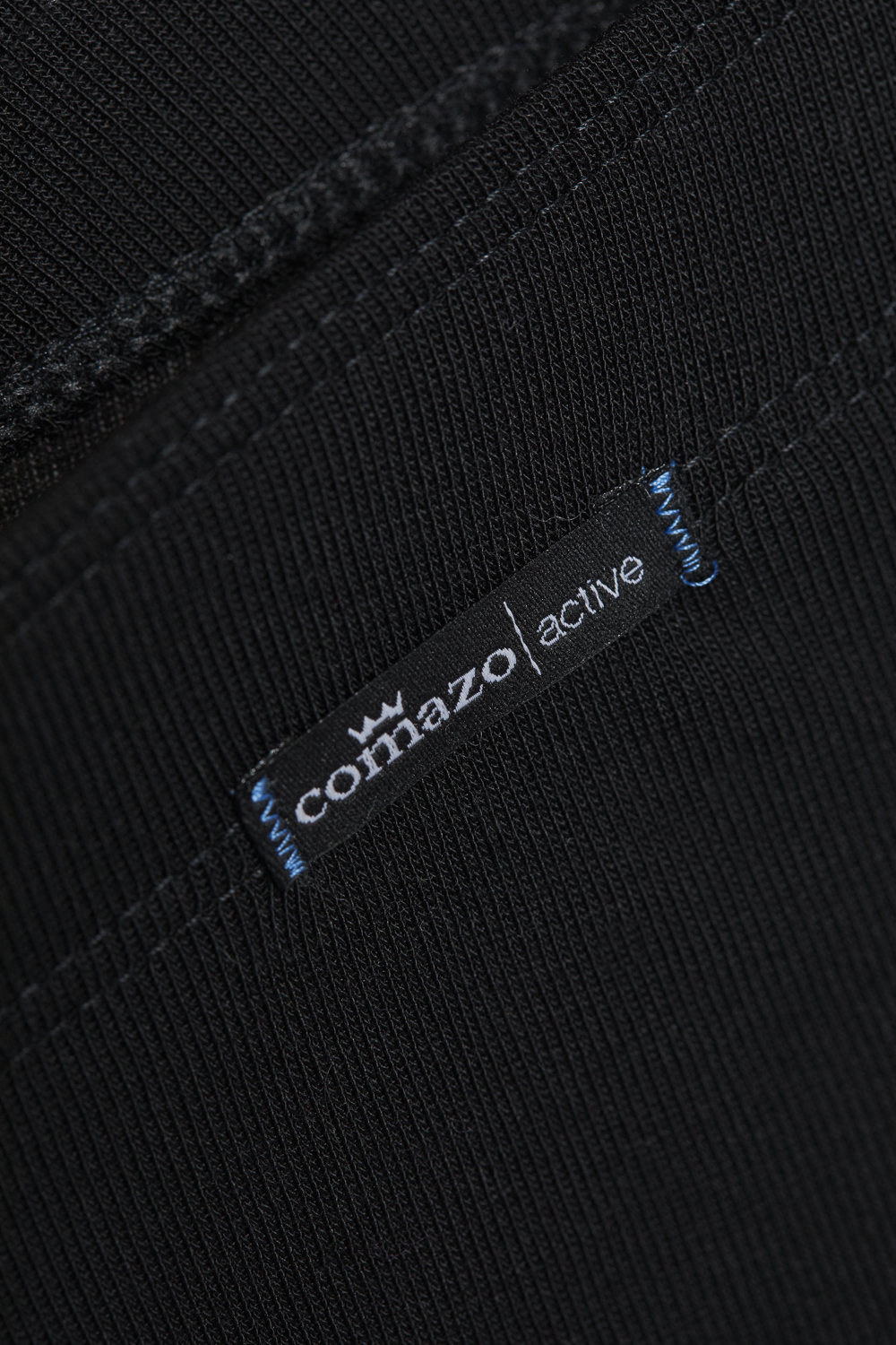 Comazo Unisex 3/4 Funktionshose "warm extra" Farbe Schwarz Detailbild Unisex 3/4 Funktionshose "warm extra" von Comazo in der Farbe Schwarz mit angerauter Innenseite zur optimalen Wärmespeicherung und schnelltrocknendem Funktionsmaterial dank sehr gutem Feuchtigkeitstransport
