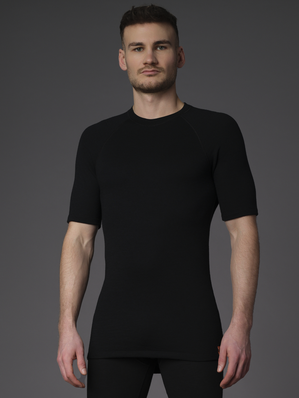 Merino Wool Shirt 1/4 Sleeve (Mulesing Free) by Comazo Protect in Black Front View: Man wearing Merino Wool Shirt 1/4 Sleeve (Mulesing Free) by Comazo Protect in Black