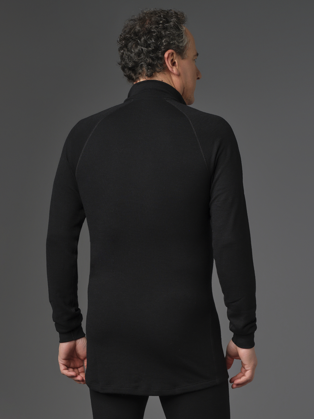 Merino Wool Shirt with Zip Collar (Mulesing Free) by Comazo Protect in Black Back View: Man wearing Merino Wool Shirt with Zip Collar (Mulesing Free) by Comazo Protect in Black