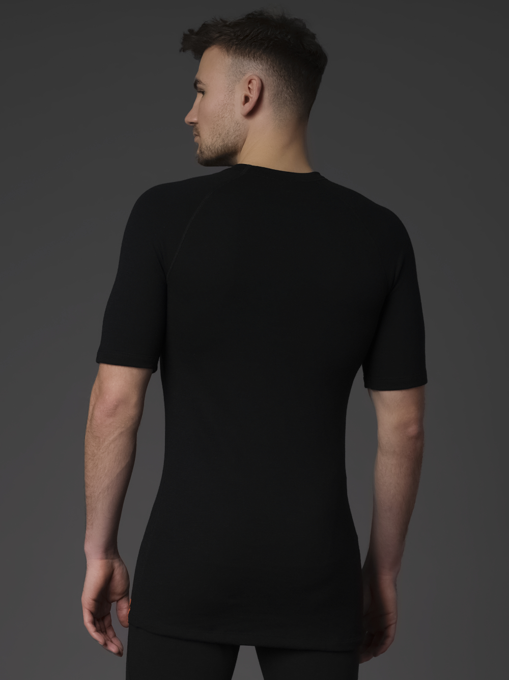 Merino Wool Shirt 1/4 Sleeve (Mulesing Free) by Comazo Protect in Black Back View: Man wearing Merino Wool Shirt 1/4 Sleeve (Mulesing Free) by Comazo Protect in Black