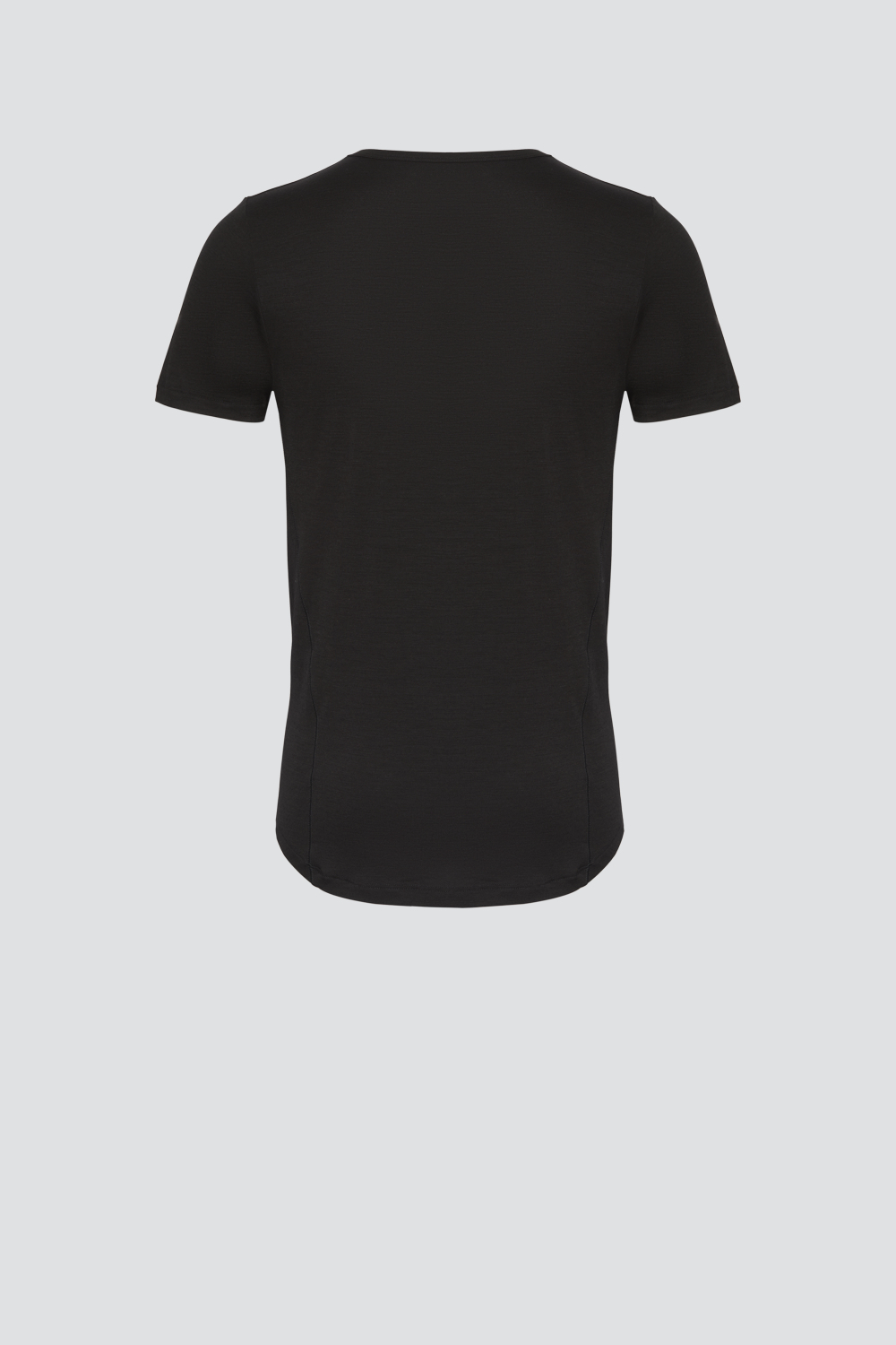 Comazo men's short-sleeve shirt made of merino wool, color black. Product image back view: Short-sleeve shirt made of merino wool by Comazo in black color with extended back panel and crew neck.