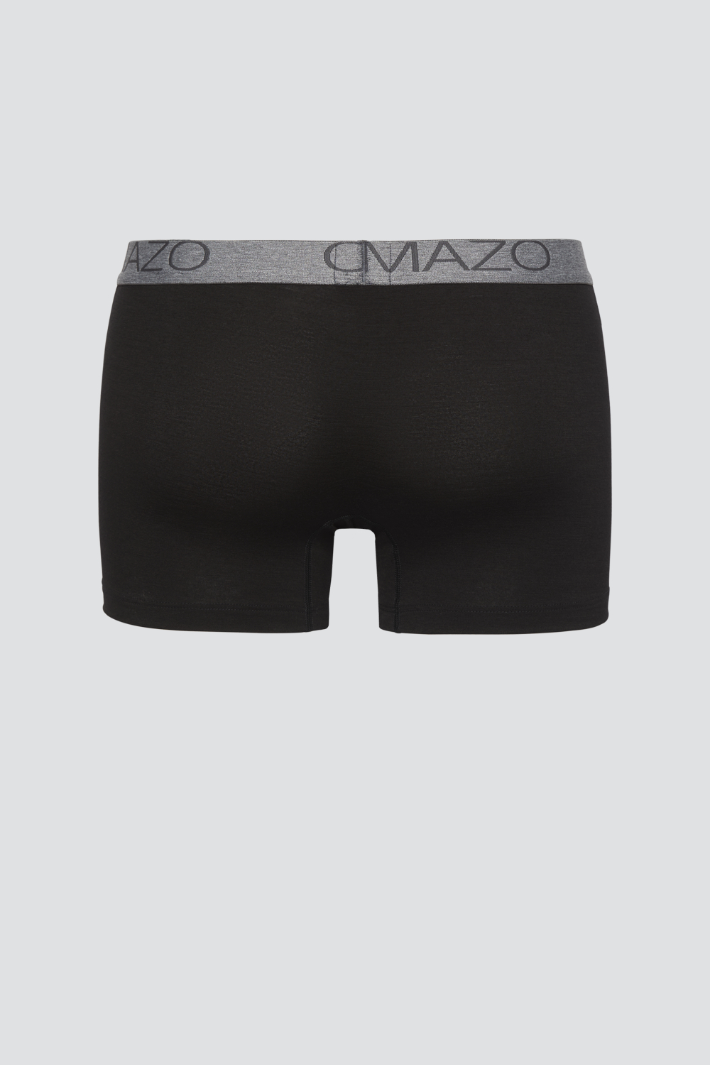 Comazo men's trunks made of merino wool in the color black. Product image back view of the merino wool trunks from Comazo in the color black with lettering on the waistband.