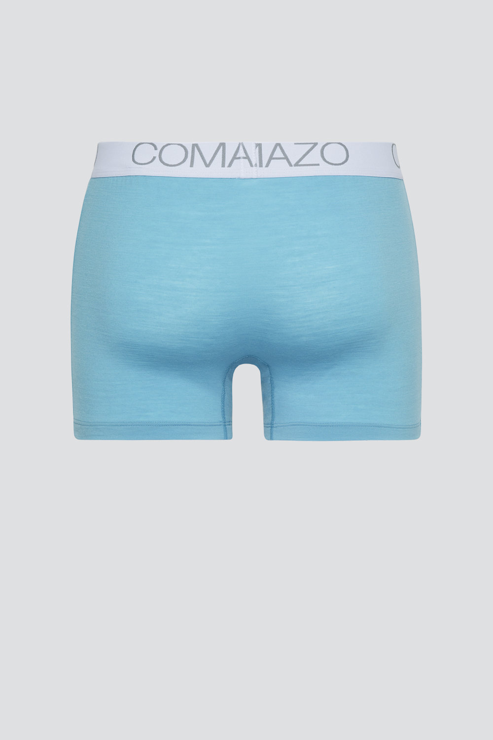 Comazo men's trunks made of merino wool in the color Seablue/Ice. Product image back view of the merino wool trunks from Comazo in the color Seablue/Ice with lettering on the waistband.